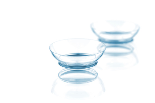Two contact lenses isolated on a white background